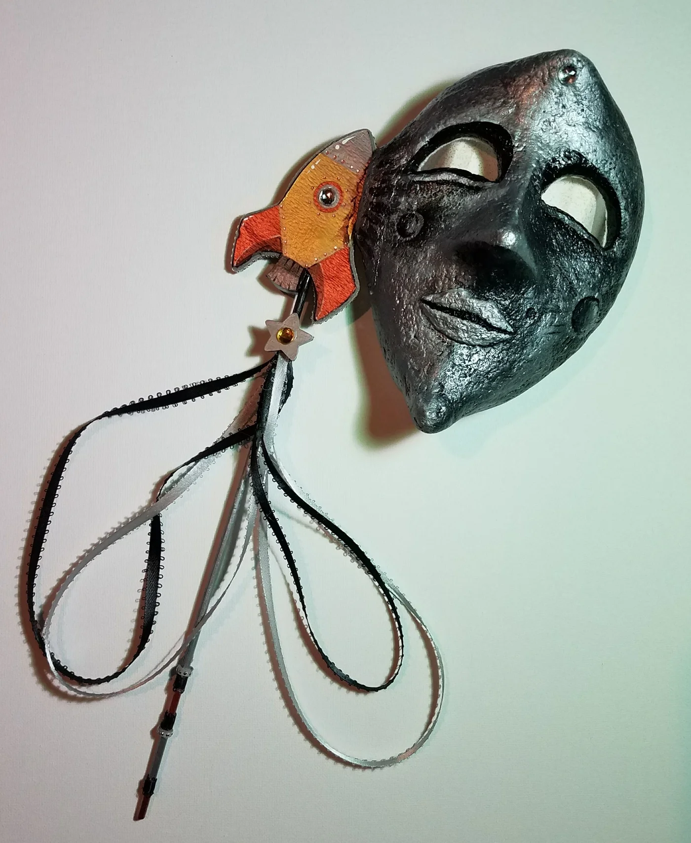 Paper craft moon mask with celestial design elements